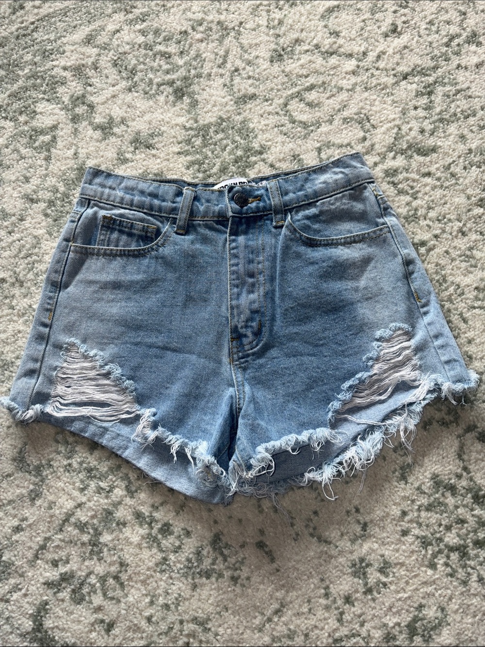 Women’s Light Blue Distressed Denim Shorts with Frayed Hem